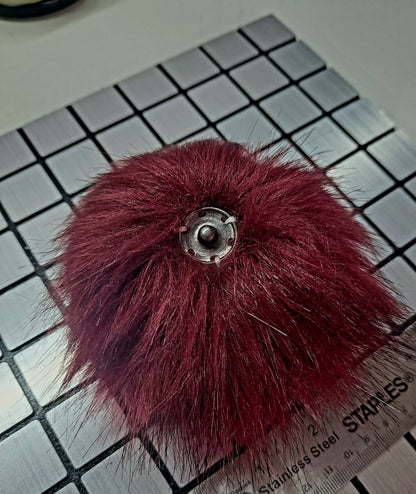 Pompom avec bouton pression