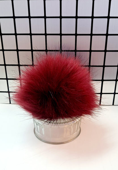 Pompom avec bouton pression