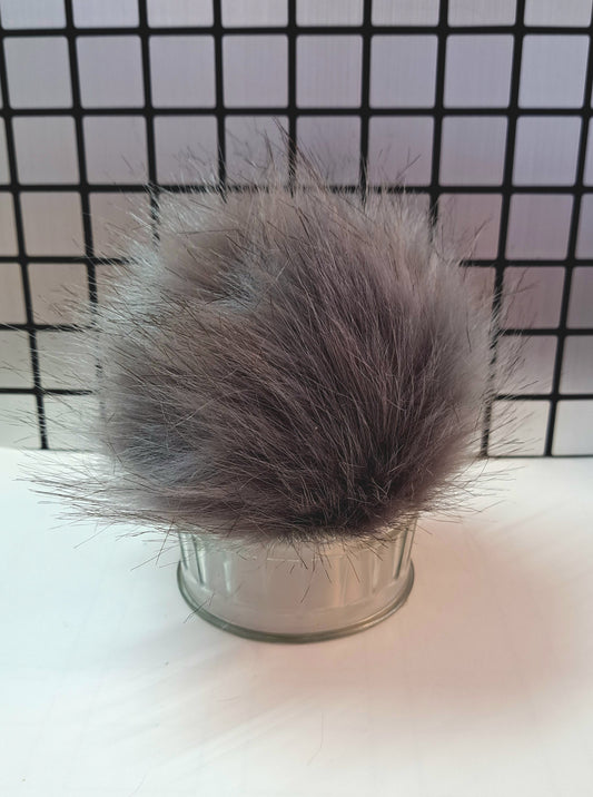 Pompom avec bouton pression